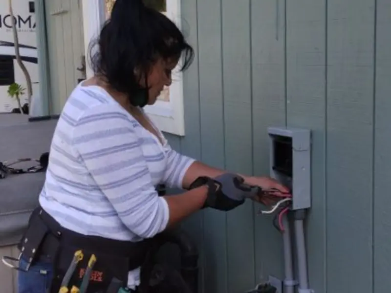 Licensed electrician wiring an exterior subpanel in Shoreline