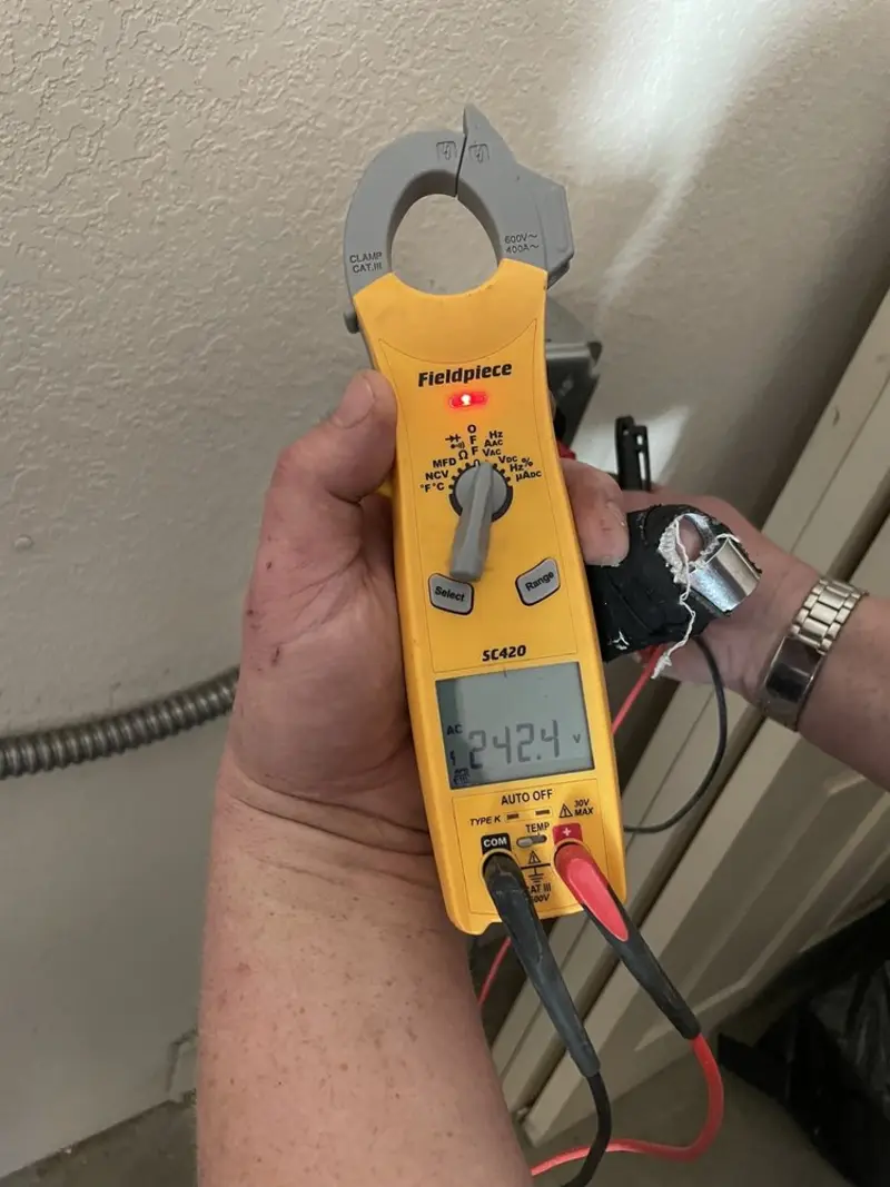 Voltage testing with clamp meter during Whole House Surge Protector in Shoreline